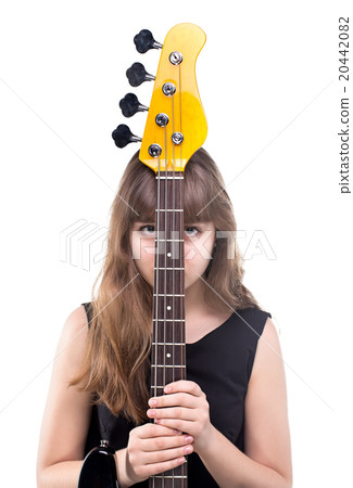 Teenage girl hidden behind bass guitar Teenage girl hidden behind bass guitar 20442082