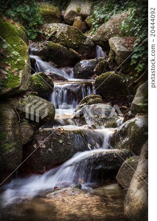 water from source flows smoothly over the rocks.  20444092