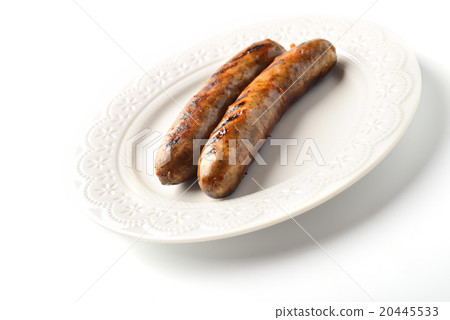 Two meat sausages on a plate on a white background 20445533