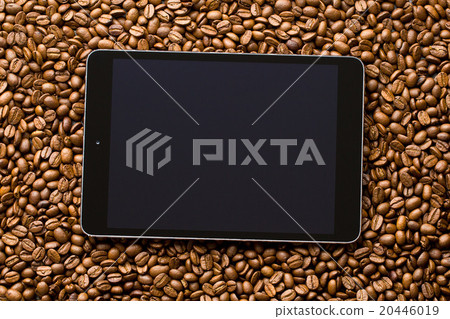 computer tablet on coffee beans computer tablet on coffee beans 20446019