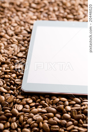 computer tablet on coffee beans 20446020