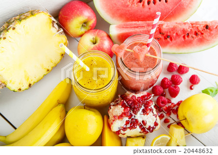 red and yellow smoothie with different fruits and red and yellow smoothie with different fruits and 20448632
