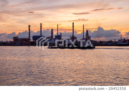 Oil refinery factory in silhouette and sunrise sky Oil refinery factory in silhouette and sunrise sky 20452358