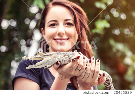 Young woman with crocodile Young woman with crocodile 20455829