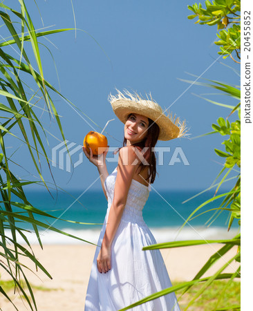 woman with coconut cocktail 20455852