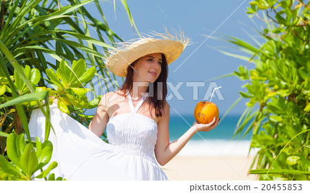 woman with coconut cocktail woman with coconut cocktail 20455853