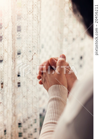 Woman praying Woman praying 20456211