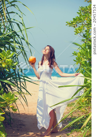 woman with coconut cocktail woman with coconut cocktail 20457534