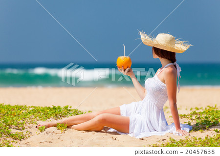 woman with coconut cocktail woman with coconut cocktail 20457638