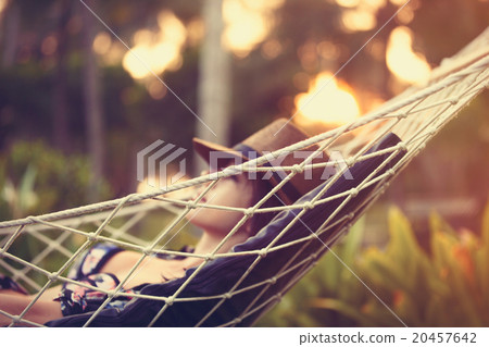 woman relaxing in a hammock 20457642