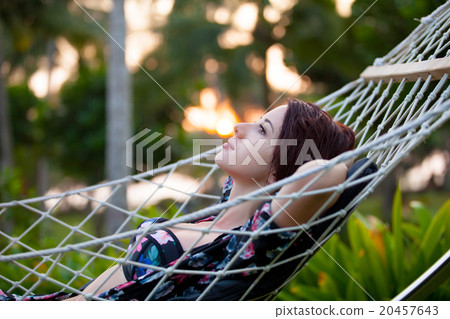 woman relaxing in a hammock woman relaxing in a hammock 20457643