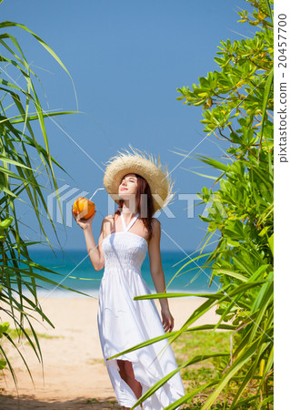 woman with coconut cocktail woman with coconut cocktail 20457700