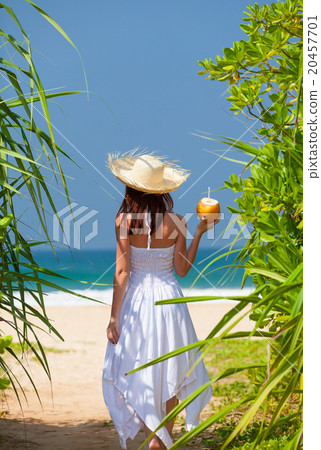 woman with coconut cocktail woman with coconut cocktail 20457701