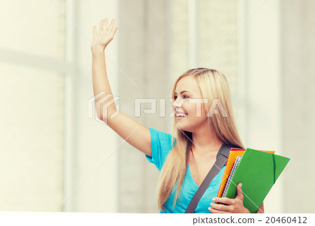 student with folders 20460412