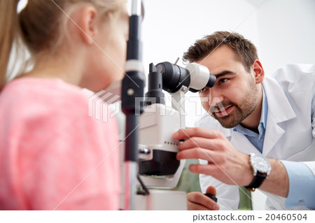 optician with tonometer and patient at eye clinic 20460504