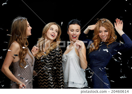 happy young women dancing at night club disco 20460614
