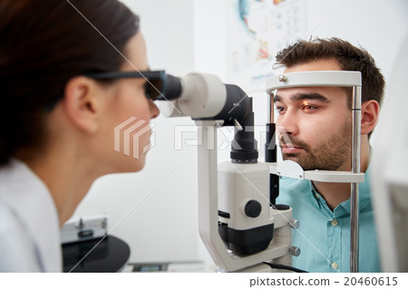 optician with tonometer and patient at eye clinic 20460615