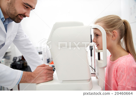 optician with tonometer and patient at eye clinic 20460664