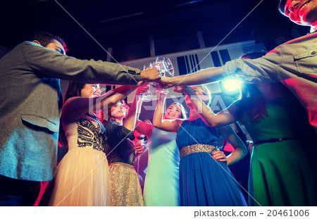 smiling friends with glasses of champagne in club 20461006