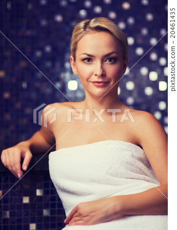 beautiful young woman sitting in bath towel 20461435