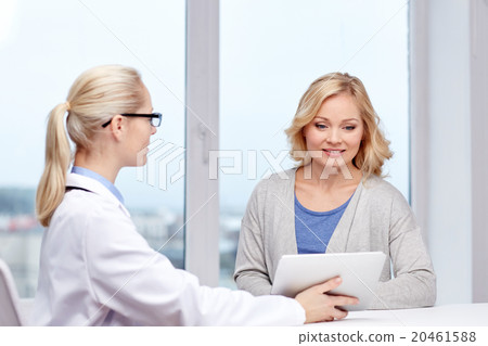 doctor with tablet pc and woman at hospital 20461588