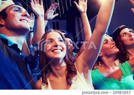 smiling friends at concert in club 20461657