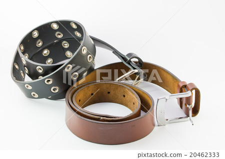 Old two leather belt roll on white background. 20462333
