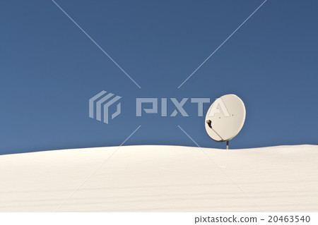 Sattelite antenna on snowy roof. Sattelite antenna on snowy roof. 20463540