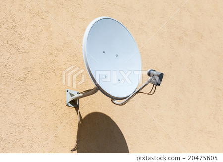 Satellite dish mounted on the wall of house Satellite dish mounted on the wall of house 20475605
