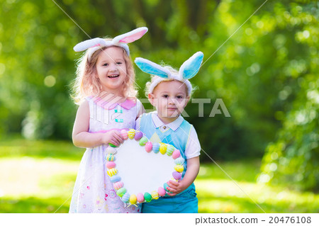 Kids having fun on Easter egg hunt Kids having fun on Easter egg hunt 20476108