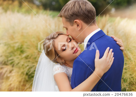 Newlyweds on a walk in the countryside Newlyweds on a walk in the countryside 20476636