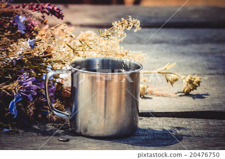 steel mug of tea on the table and fresh flowers, steel mug of tea on the table and fresh flowers, 20476750