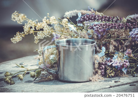 steel mug of tea on the table and fresh flowers, steel mug of tea on the table and fresh flowers, 20476751