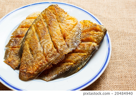 Fried trichogaster pectoralis fish on dish. 20484940