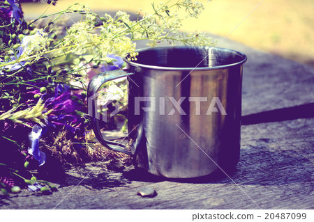steel cup for a hike with flowers and table steel cup for a hike with flowers and table 20487099