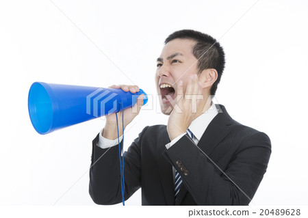 Male businessman shouting at megaphone Male businessman shouting at megaphone 20489628