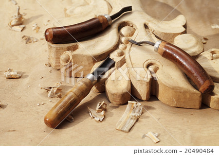 carving tool closeup on wooden background 20490484