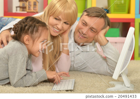 happy family playing on computer happy family playing on computer 20491433