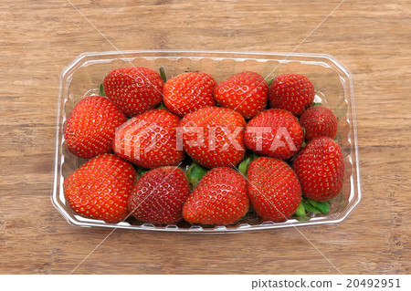 ripe juicy strawberries on a wooden background 20492951