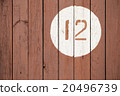 Number 12 on a wooden surface 20496739