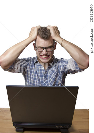 Aggressive boy sitting at the Computer Aggressive boy sitting at the Computer 20512640