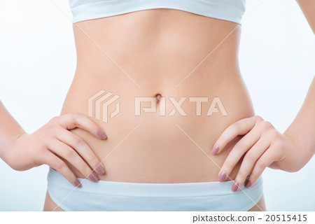 Slim woman standing isolated on white background  20515415