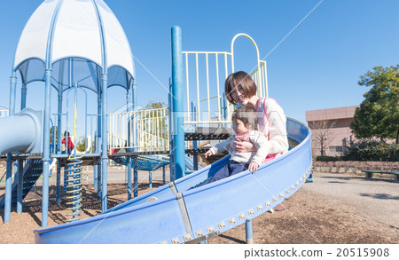 Infants playing on a slide 20515908
