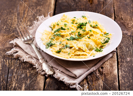 plate of ravioli on wooden table 20526724