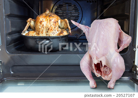 raw chicken shows at a roasted chicken in oven 20527107