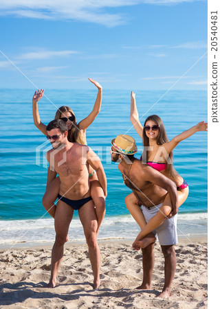 Boys flirt with girls at the resort.  20540481