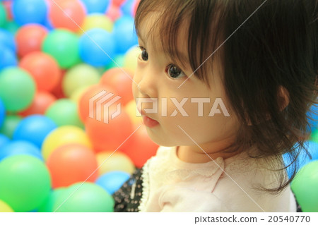 Baby playing with ball pool (1 year old child) 20540770