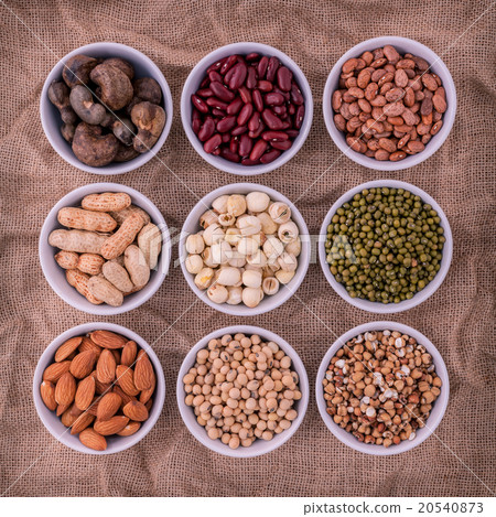 Mixed beans , lentils and nuts in the white bowl . Mixed beans , lentils and nuts in the white bowl . 20540873