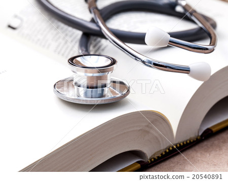 Stethoscope on a textbooks . 20540891