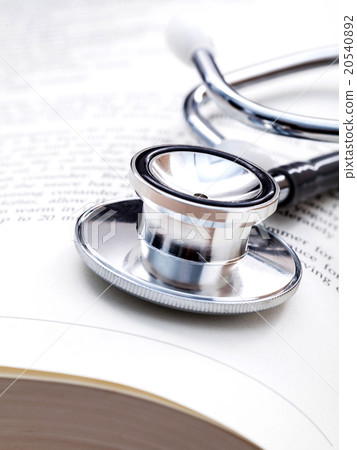 Stethoscope on a textbooks . 20540892